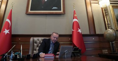 President Recep Tayyip Erdogan speaking on the phone at the Presidential Complex in Ankara, Oct. 9, 2019. (AFP via Presidency, File Photo)