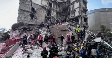 First responders search for missing people under the rubble of a partially destroyed residential building following an Israeli air strike, in the Tallet al-Khayat neighborhood of Beirut, Lebanon, April 8, 2026. (EPA Photo)