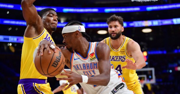 Oklahoma City Thunder's Shai Gilgeous-Alexander (C) moves the ball against Los Angeles Lakers forward Rui Hachimura (L) during the second half at Crypto.com Arena, Los Angeles, U.S., April 7, 2026. (Reuters Photo)