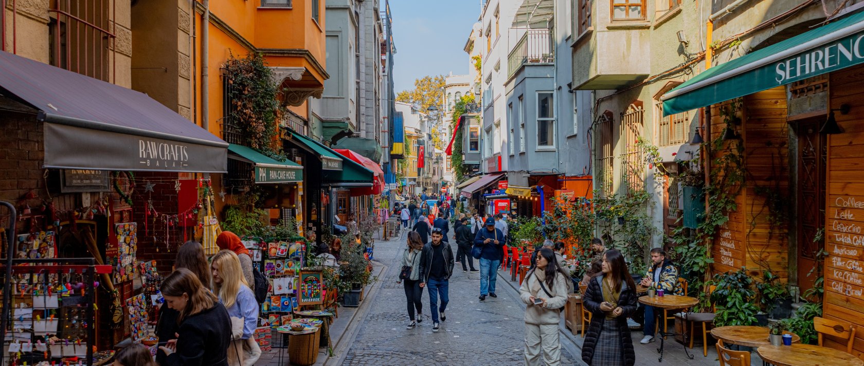 People walk on a historic street of the Balat district known for its colorful buildings, Istanbul, Türkiye, Nov. 2, 2024. (Shutterstock Photo)