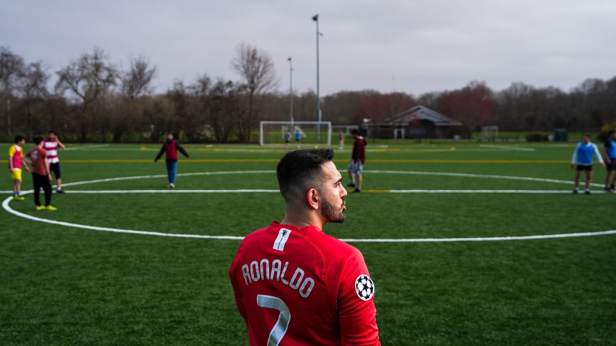 Tehran native and Stony Brook University graduate student Arad Ershad plays football with friends at Stony Brook University, Stony Brook, U.S., April 3, 2026. (AP Photo)