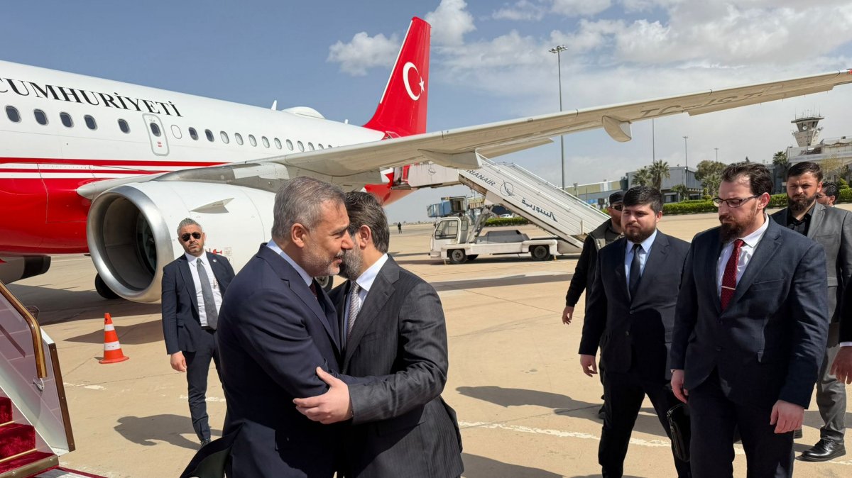 Syrian Foreign Minister Asaad al-Shaibani (R) welcomes Foreign Minister Hakan Fidan as the latter arrives at the airport, Damascus, Syria, April 5, 2026. (AA Photo)