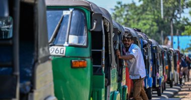 Drivers wait to refuel their auto rickshaws at a fuel station in Biyagama on the outskirts of Colombo, Sri Lanka, March 15, 2026. (AFP Photo)