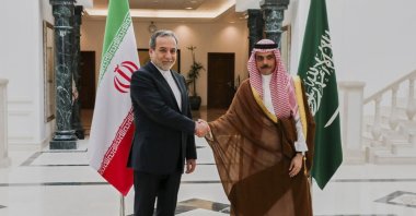 This file photo shows Iranian Foreign Minister Abbas Araghchi (L) shaking hands with his Saudi counterpart Prince Faisal bin Farhan in Jeddah, Saudi Arabia, May 10, 2025. (AP Photo)