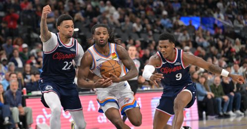Oklahoma City Thunder's Cason Wallace (C) is defended by Los Angeles Clippers guard Jordan Miller (L) and guard Bennedict Mathurin as he drives to the basket in the second half at Intuit Dome, Inglewood, U.S., April 8, 2026. (Reuters Photo)