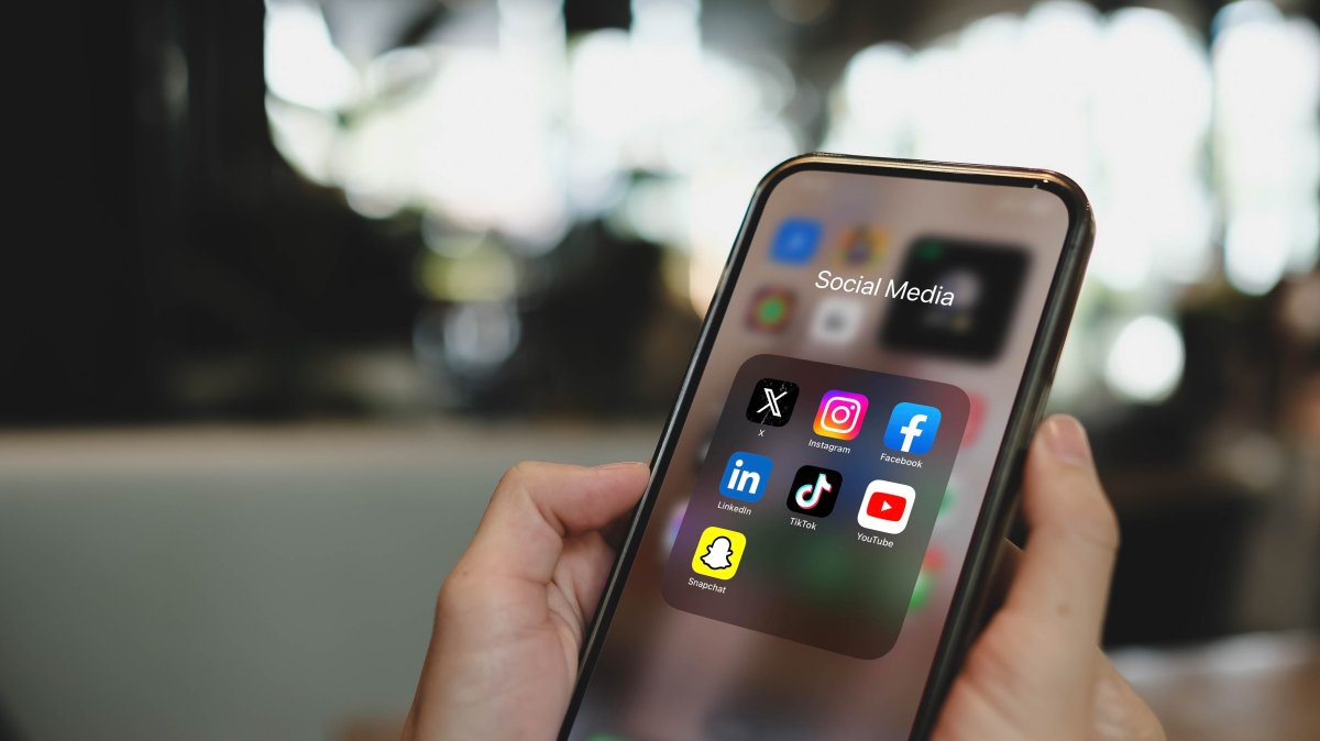 Social media applications are seen on a phone screen. (Shutterstock Photo)