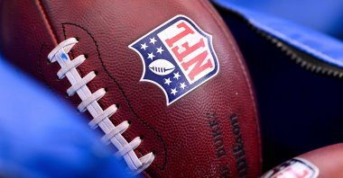 A detail view of the NFL shield on a football prior to an NFL football game between the Houston Texans and the Indianapolis Colts, Houston, U.S., Jan. 4, 2026. (AP Photo)