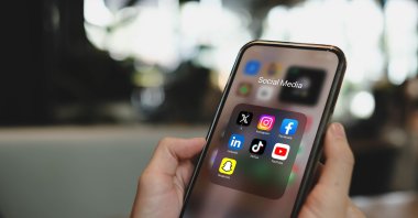 Social media applications are seen on a phone screen. (Shutterstock Photo)