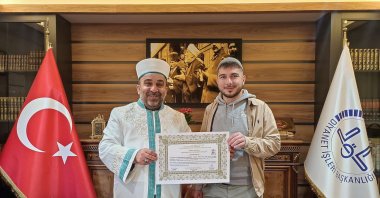 Mehmet during the conversion ceremony at the Karasu District Mufti’s Office, Sakarya, Türkiye, April 9, 2026. (AA Photo) 