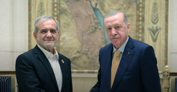 President Recep Tayyip Erdoğan meets with Iranian President Masoud Pezeshkian on the sidelines of D-8 summit, Cairo, Egypt, Dec. 19, 2024. (DHA Photo)