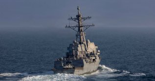 Arleigh Burke-class guided-missile destroyer USS Frank E. Petersen Jr. sails in the Arabian Sea for a mission supporting Operation Epic Fury during the Iran war at an undisclosed location, March 18, 2026. (Reuters Photo)