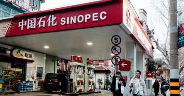 People walk past the SINOPEC petrol station, Shanghai, China, March 19, 2026. (EPA Photo)