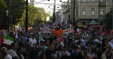 Demonstrators hold a cardboard sign showing Israeli Prime Minister Benjamin Netanyahu, during a pro-Palestinian protest, Istanbul, Türkiye, June 1, 2024. (AP Photo)