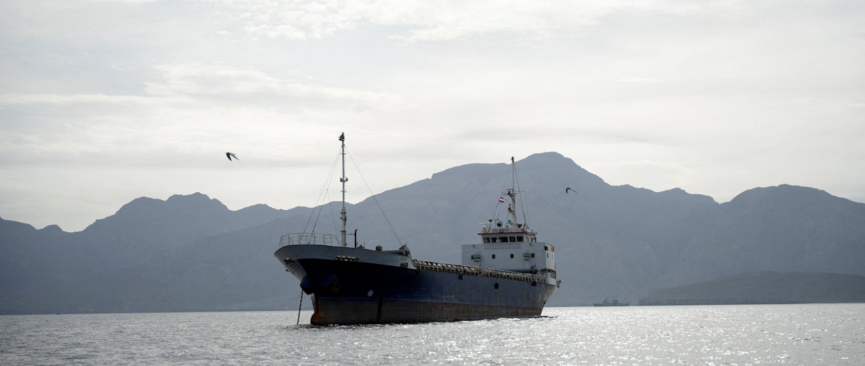A vessel at the Strait of Hormuz, off the coast of Oman’s Musandam province, April 12, 2026. REUTERS