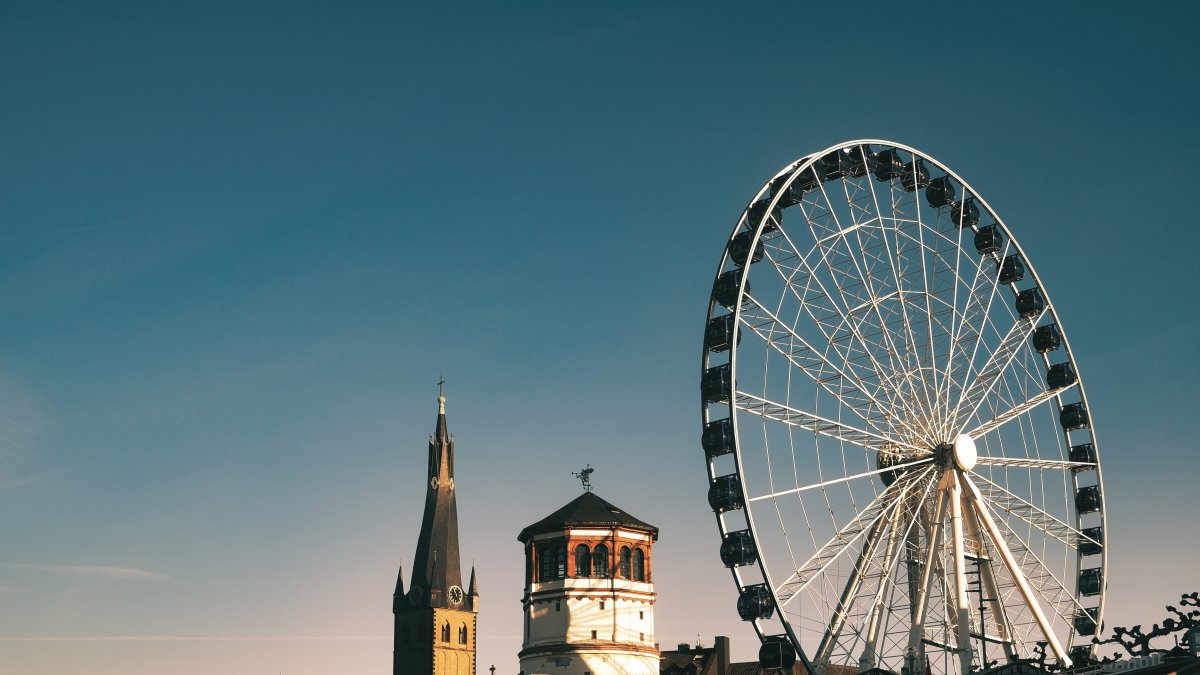 A ferris wheel on the Rhine River, Düsseldorf, Germany. (Shutterstock Photo)