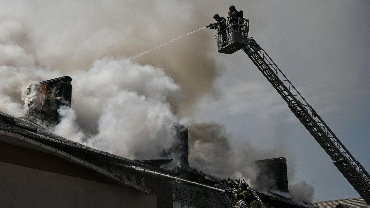 Firefighters work at the site of a building hit by a Russian drone strike, amid Russia's attack on Ukraine, in Zaporizhzhia, Ukraine, April 13, 2026. REUTERS/Stringer 