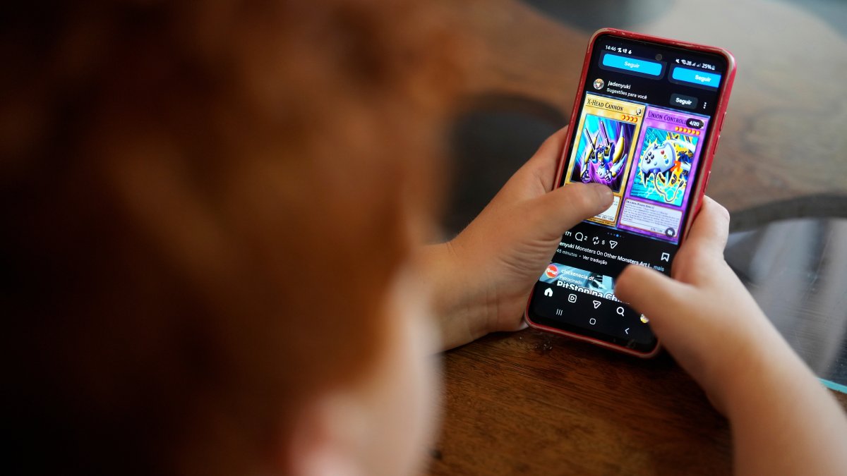 A boy uses a social media platform in Brasilia, Brazil, March 19, 2026. (AP Photo)