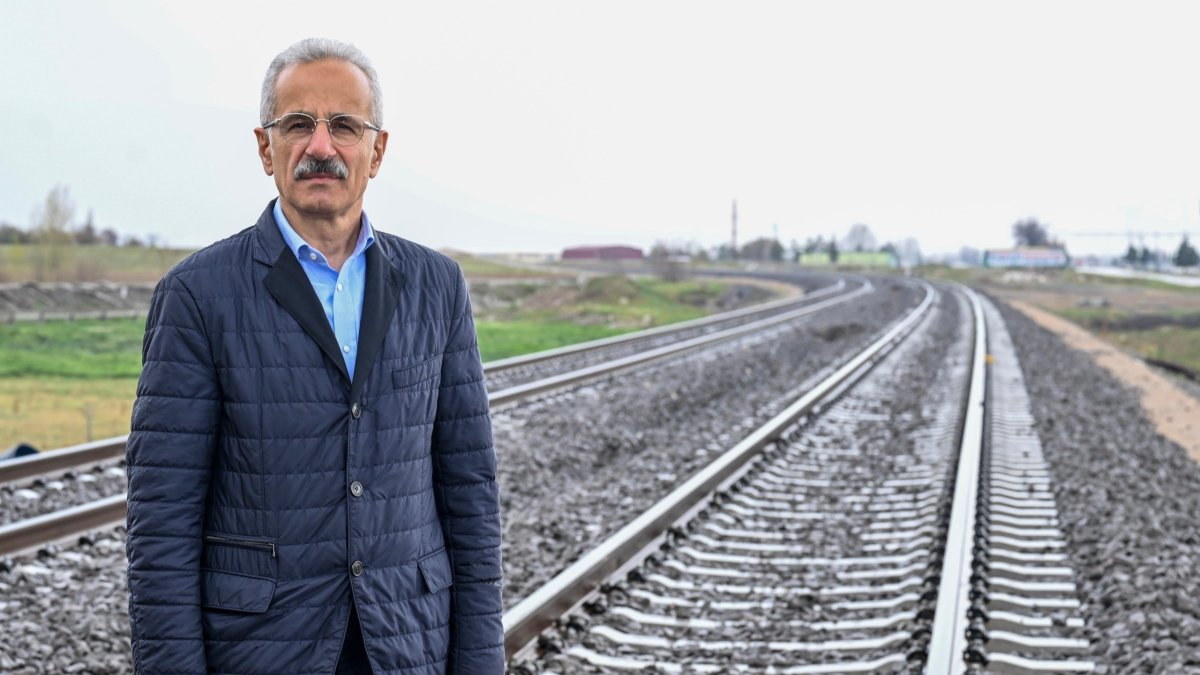 Transport Minister Abdulkadir Uraloğlu is seen next to a railway, Türkiye, April 13, 2026. (DHA Photo)