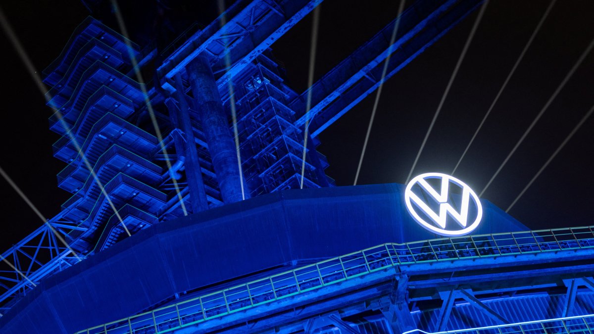 A logo of Volkswagen appears on the illuminated preserved blast furnace during the company’s event at Shougang park in Beijing, China, April 8, 2026. (Reuters Photo)