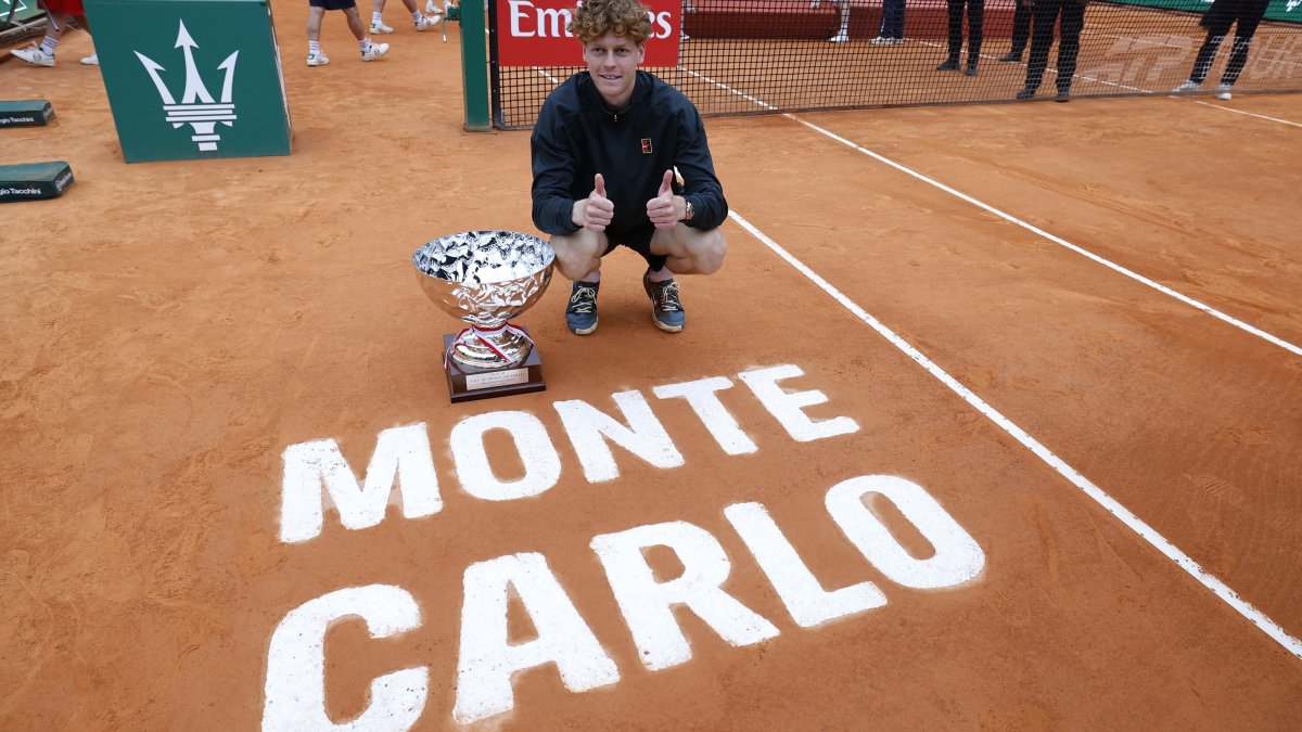 Italy's Jannik Sinner poses with his trophy after winning the ATP Monte-Carlo Masters final against Spain's Carlos Alcaraz, Roquebrune Cap Martin, France, April 12, 2026. (EPA Photo)