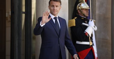 French President Emmanuel Macron gestures as he walks out of the Elysee Palace to welcome Ghana's president on his arrival, Paris, France, April 8, 2026.  (EPA Photo)