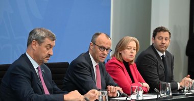 (L-R) Bavaria's State Premier and leader of the conservative Christian Social Union (CSU) Markus Soeder, German Chancellor Friedrich Merz of the conservative Christian Democratic Union (CDU), German Minister for Labour and Social Affairs Baerbel Bas from the social democratic SPD party, and German Finance Minister and Vice Chancellor Lars Klingbeil (SPD) attend a press briefing on the results of overnight coalition committee consultations at the Chancellery, Berlin, Germany, April 13, 2026. (AFP Photo)