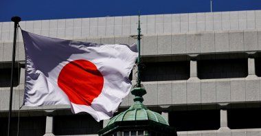 The Japanese national flag waves at the Bank of Japan building, Tokyo, Japan, March 18, 2024. (Reuters Photo)