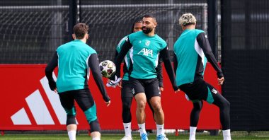 Liverpool's Mohamed Salah with Hugo Ekitike, Florian Wirtz and Rio Ngumoha attend a training session ahead of a UEFA Champions League match against PSG, Liverpool, U.K., April 13, 2026. (Reuters Photo)