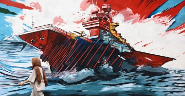 A woman walks next to an anti-U.S. mural on a street in Tehran, Iran, April 12, 2026. (Reuters Photo)