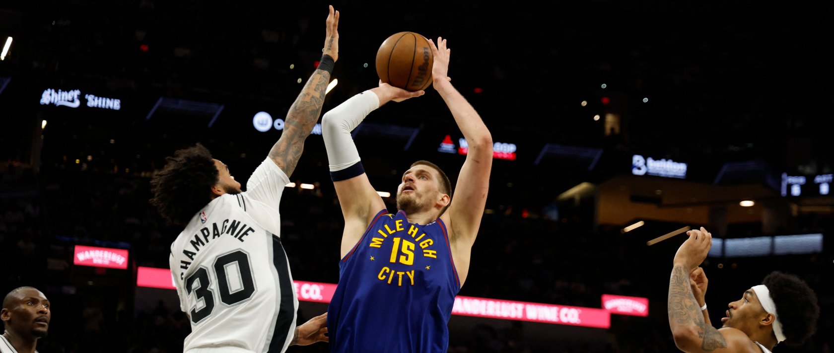 Nuggets' Nikola Jokic shoots over Spurs' Julian Champagnie during an NBA game in San Antonio, Texas, April 12, 2026. (AFP Photo)