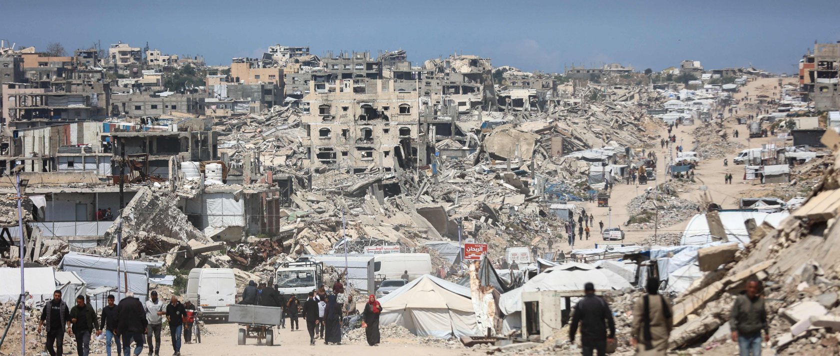 Palestinians walk amid the rubble of destroyed buildings in the Jabalia refugee camp in the northern Gaza Strip, April 13, 2026. (AFP Photo)