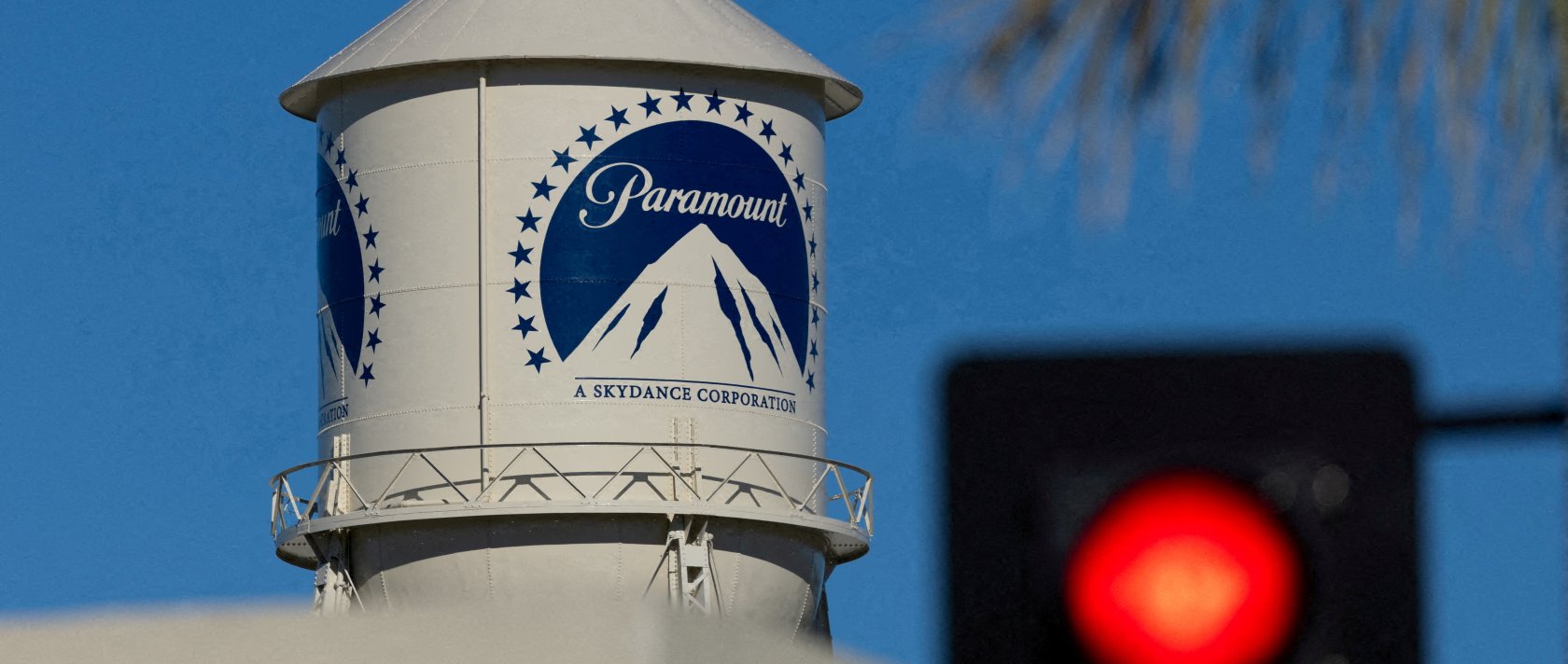 A city street stop sign is shown next to the Paramount water tower at the Paramount studio lot in Hollywood, Los Angeles, California, U.S., Jan. 13, 2026. (Reuters Photo)