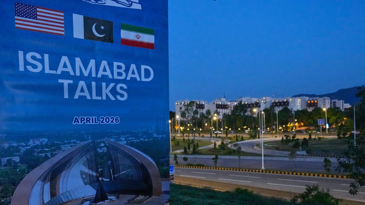A billboard of the U.S. Iran talks is seen near Serena Hotel, the venue for the U.S. Iran officials meeting, in Islamabad, Pakistan, April 12, 2026. (AP Photo)