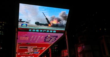 A giant screen shows a news report on China's "Justice Mission 2025" military drills around Taiwan, Beijing, China, Dec. 30, 2025. (Reuters File Photo)