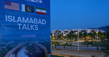 A billboard of the U.S. Iran talks is seen near Serena Hotel, the venue for the U.S. Iran officials meeting, in Islamabad, Pakistan, April 12, 2026. (AP Photo)