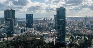 Aerial view of the city downtown and skyscrapers with the Bosporus background, Istanbul, Türkiye, Jan. 30, 2024. (Shutterstock Photo)