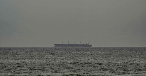 A ship is seen in the Persian Gulf off the coast of Sharjah, United Arab Emirates, April 13, 2026. (AFP Photo)