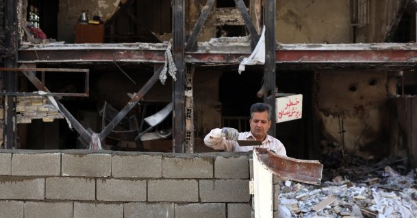 An Iranian worker works on a damaged residential building which was destroyed by U.S.-Israeli airstrikes in southern Tehran, Iran, April 14, 2026. (EPA Photo)