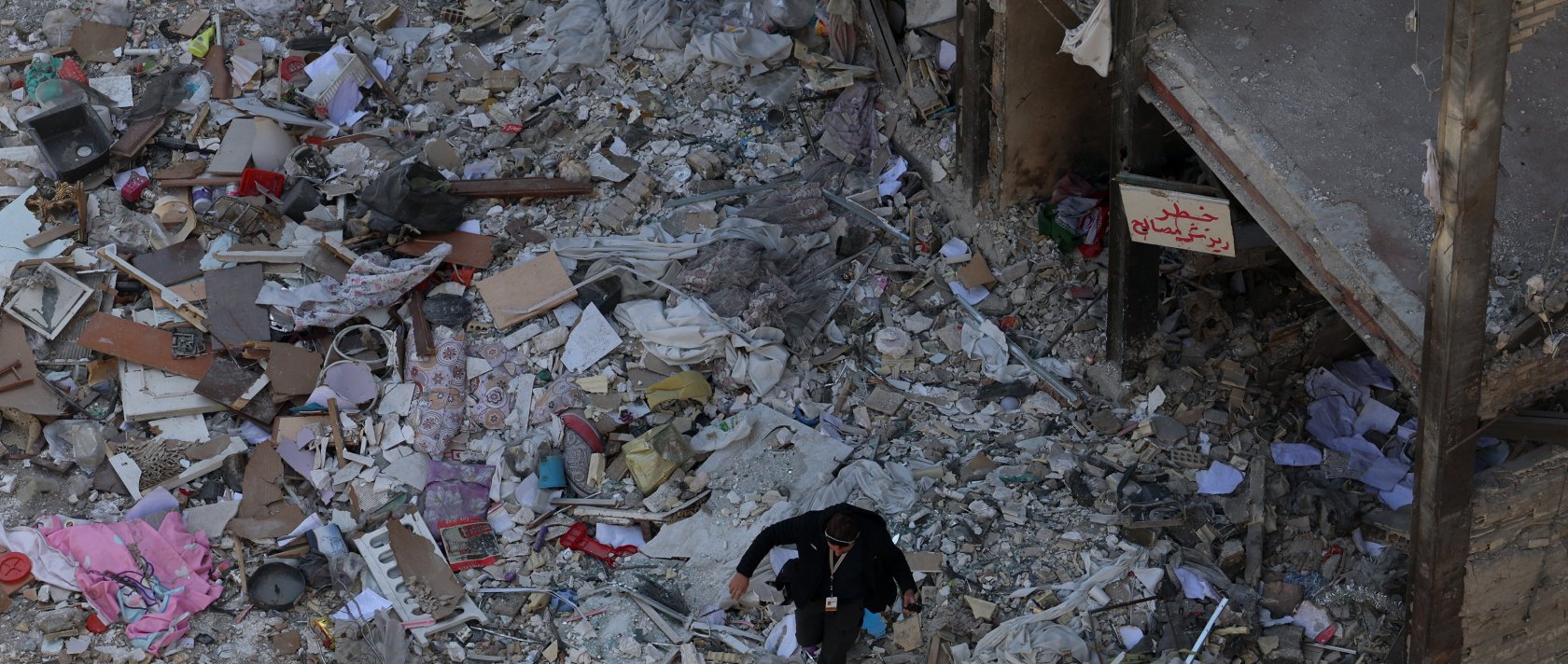 A member of the media works at the scene of residential buildings which were destroyed by U.S.-Israeli airstrikes at the Shahid Broujerdi residential complex in southern Tehran, Iran, April 14, 2026. (EPA Photo)