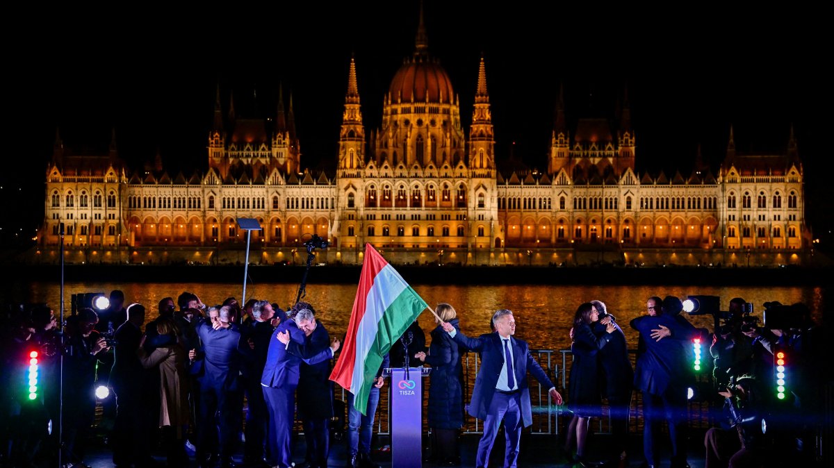 Peter Magyar, leader of the opposition Tisza party, holds a national flag following the partial results of the parliamentary election, Budapest, Hungary, April 12, 2026. (Reuters Photo)