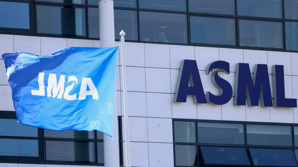 A flag and a logo at ASML offices in Veldhoven, Netherlands, March 24, 2026. (Reuters Photo)