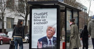 A poster with U.S. President Donald Trump asking how to blow up a school, referring to OpenAI/ChatGPT having signed a deal with the U.S. Department of War, London, U.K., March 13, 2026. (Getty Images Photo)