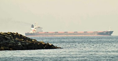 A cargo ship is pictured off the coast city of Fujairah in the Strait of Hormuz, United Arab Emirates, Feb. 25, 2026. (AFP Photo)