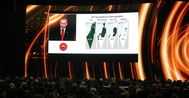 President Recep Tayyip Erdoğan gives a speech with a screening displays maps of Israel and the Palestinian territories in history, during Antalya Diplomacy Forum, Antalya, southern Türkiye, March 1, 2024. (AP Photo)