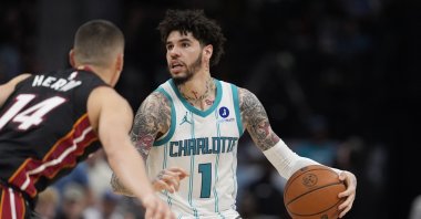 Hornets' guard LaMelo Ball is defended by Heat's guard Tyler Herro during an NBA play-in tournament match, Charlotte, North Carolina, U.S., April 14, 2026. (Reuters Photo)