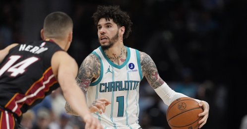 Hornets' guard LaMelo Ball is defended by Heat's guard Tyler Herro during an NBA play-in tournament match, Charlotte, North Carolina, U.S., April 14, 2026. (Reuters Photo)