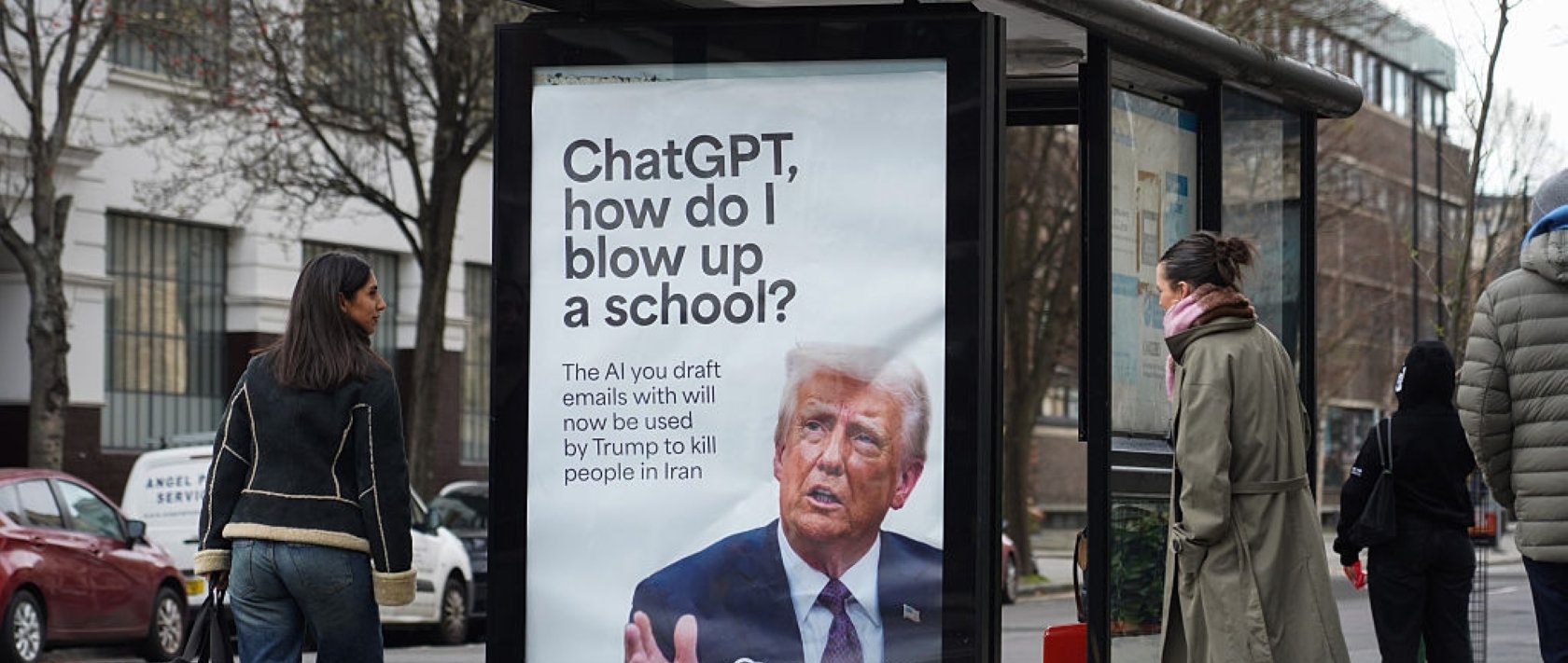 A poster with U.S. President Donald Trump asking how to blow up a school, referring to OpenAI/ChatGPT having signed a deal with the U.S. Department of War, London, U.K., March 13, 2026. (Getty Images Photo)