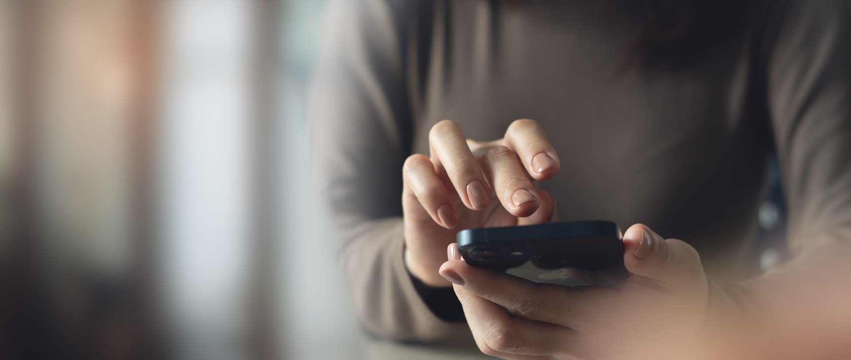 A woman using a mobile phone. (Shutterstock Photo)