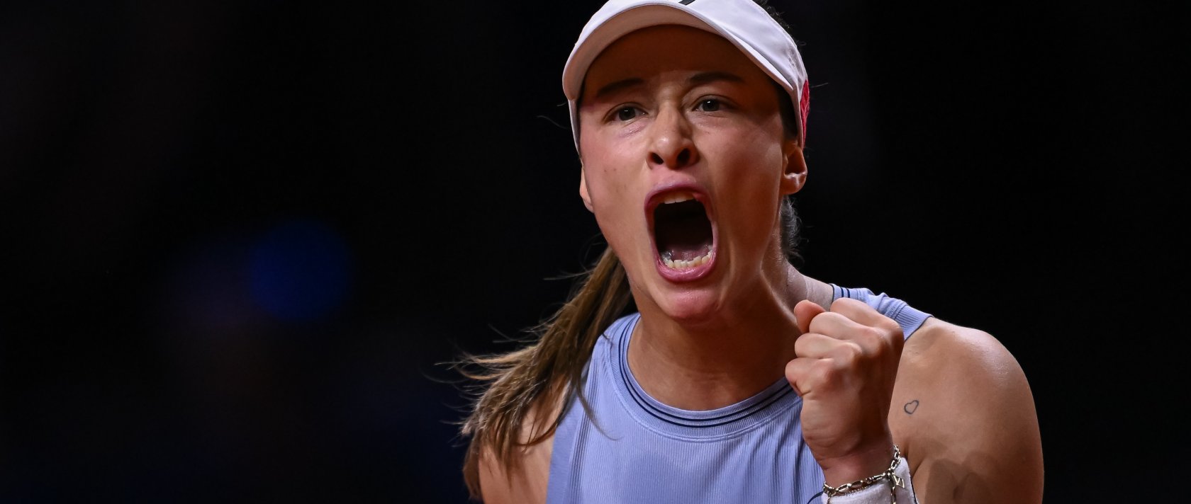 Türkiye's Zeynep Sönmez celebrates against Jasmine Paolini of Italy during a Porsche Tennis Grand Prix 2026 match in Stuttgart, Germany, April 15, 2026. (Getty Images Photo)