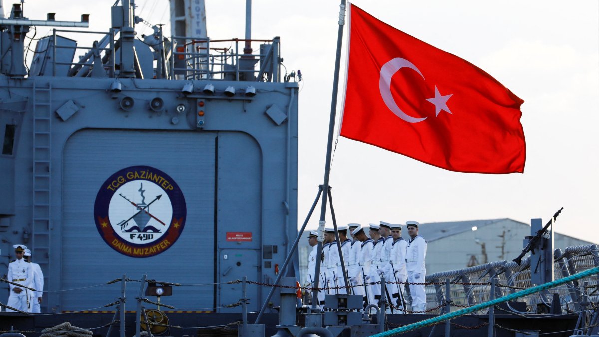 Turkish naval officers stand aboard the TCG Gaziantep (F-490), operated by the Turkish Naval Forces, before the ceremony to launch the drilling vessel Çağrı Bey, which is set to conduct Türkiye's first deep-sea drilling operation in the Indian Ocean near the Port of Mogadishu, Mogadishu, Somalia, April 10, 2026. (Reuters Photo)